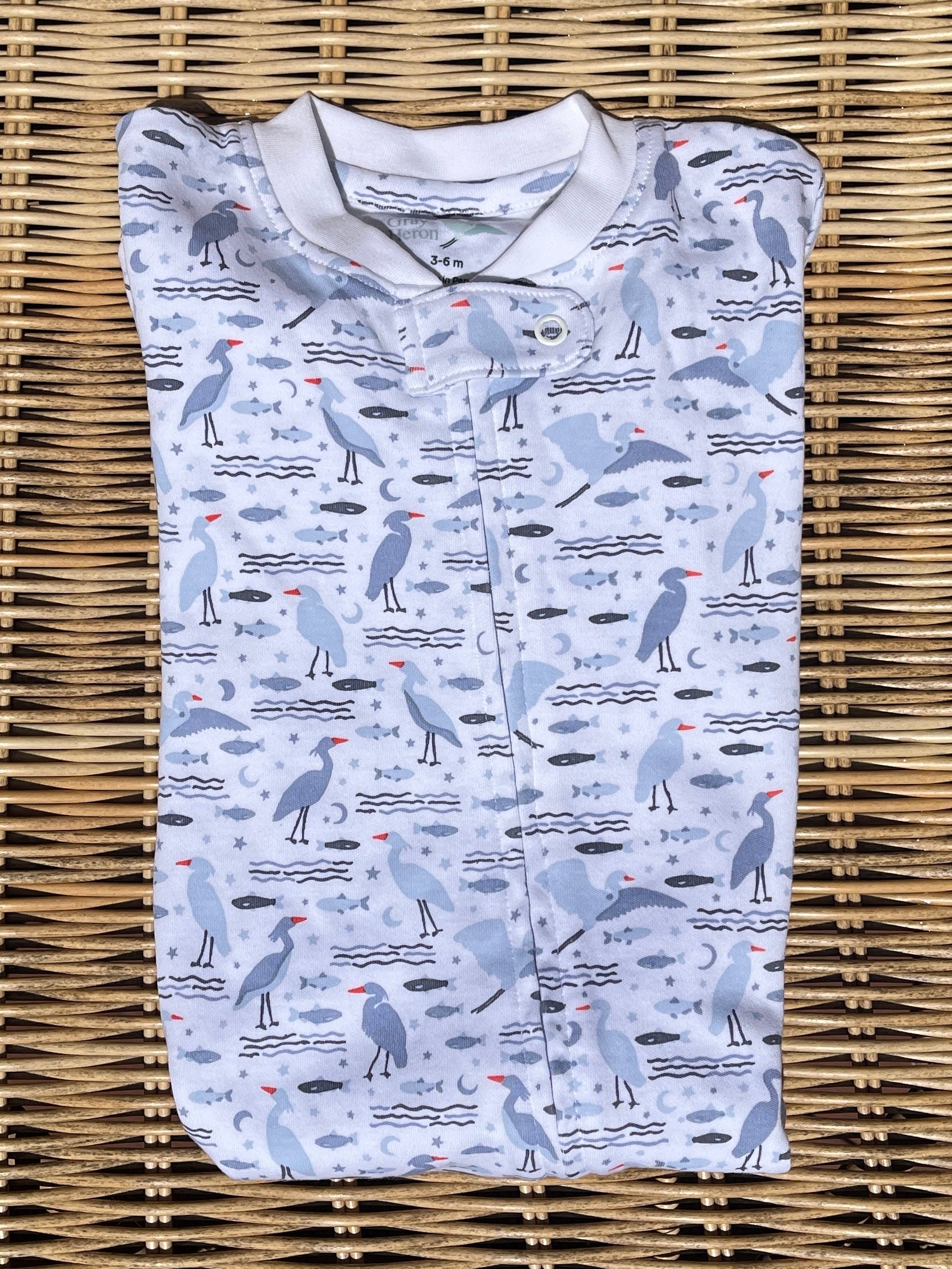 organic heron print baby pajamas with blue herons, water, fish and moons