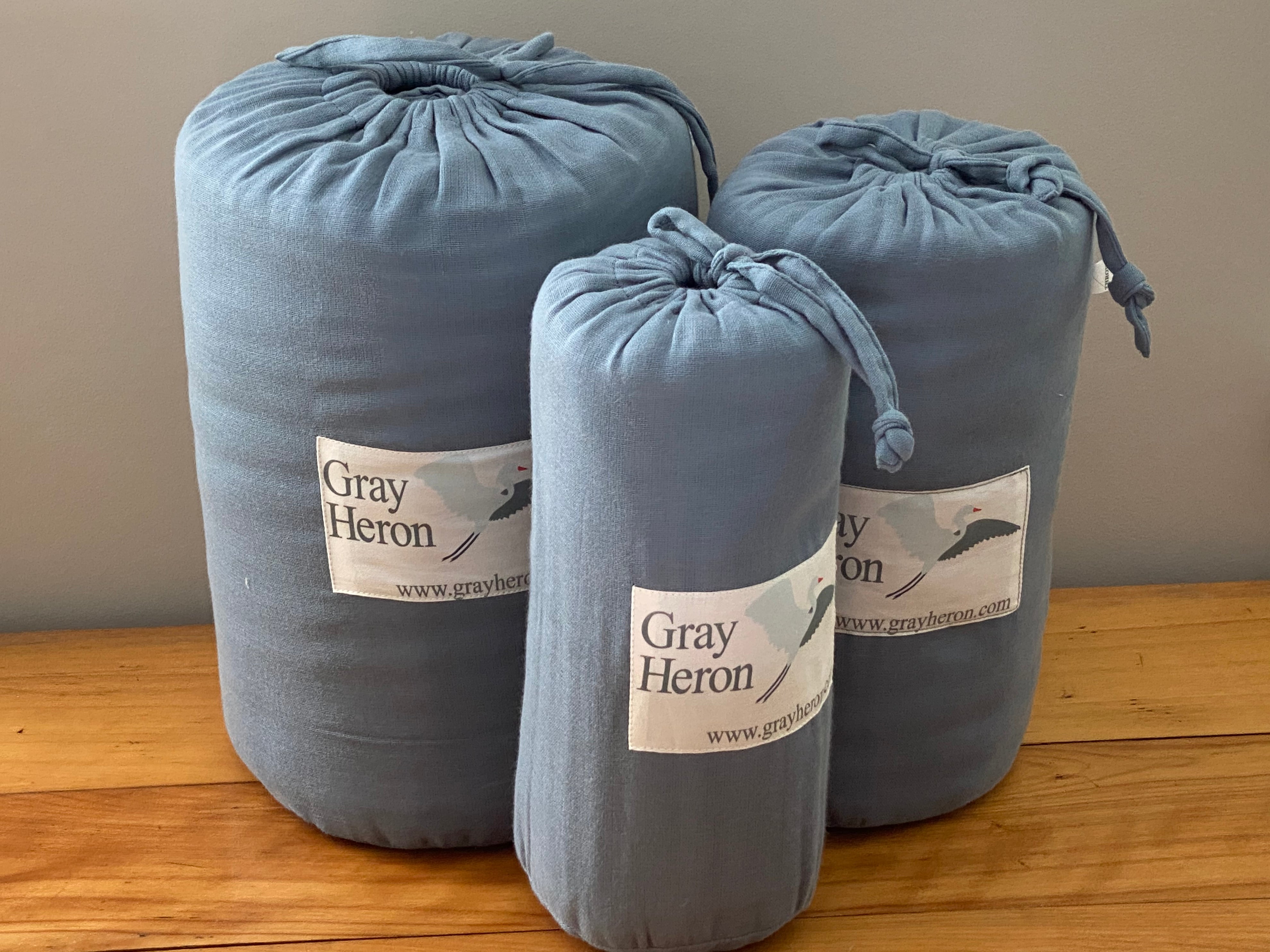 gray heron blankets in reusable cotton muslin cinch bags 4 and 8 layer blankets